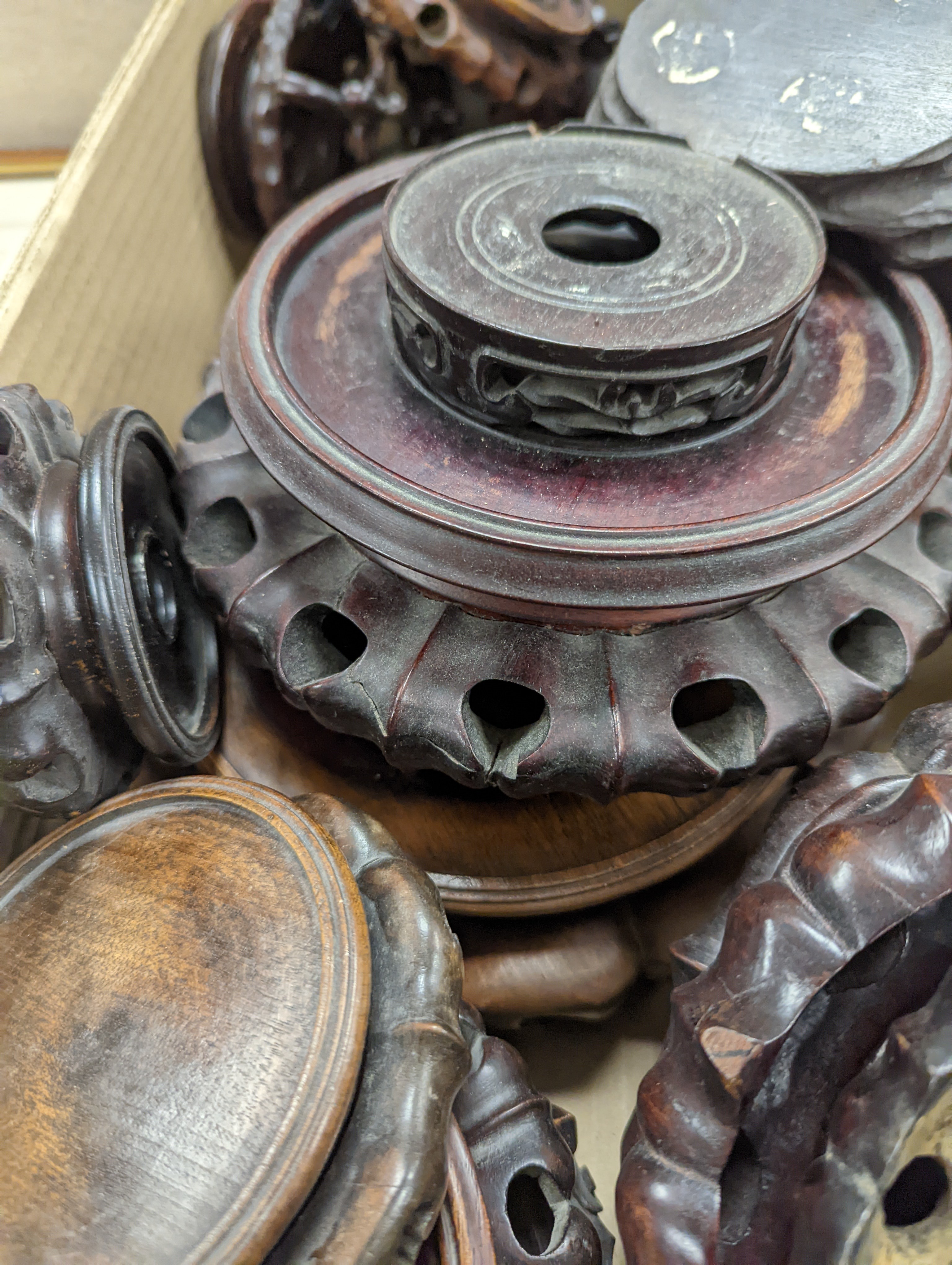 A large collection of Chinese hardwood stands.